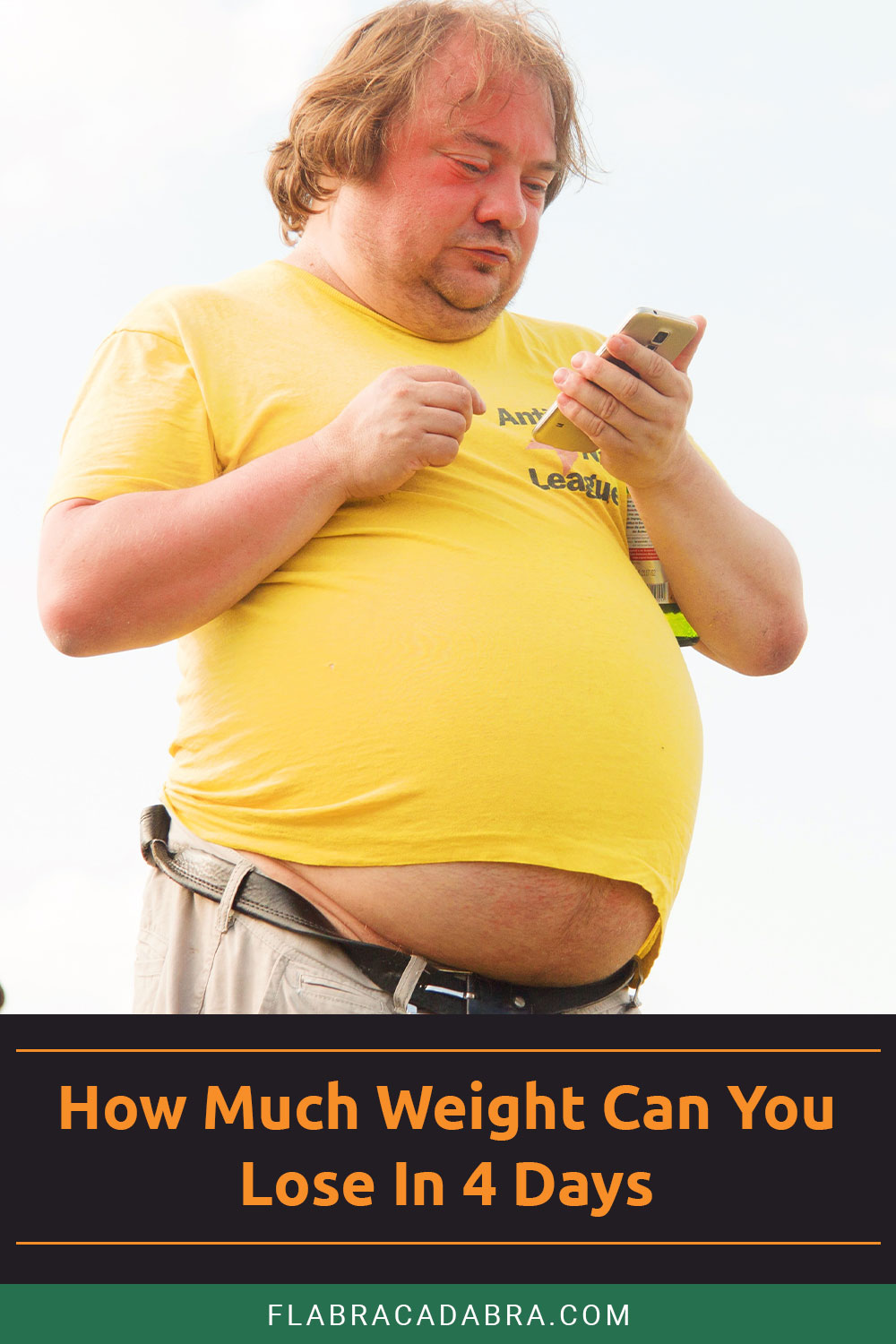 Overweight man in yellow shirt looking at phone - How Much Weight Can You Lose In 4 Days