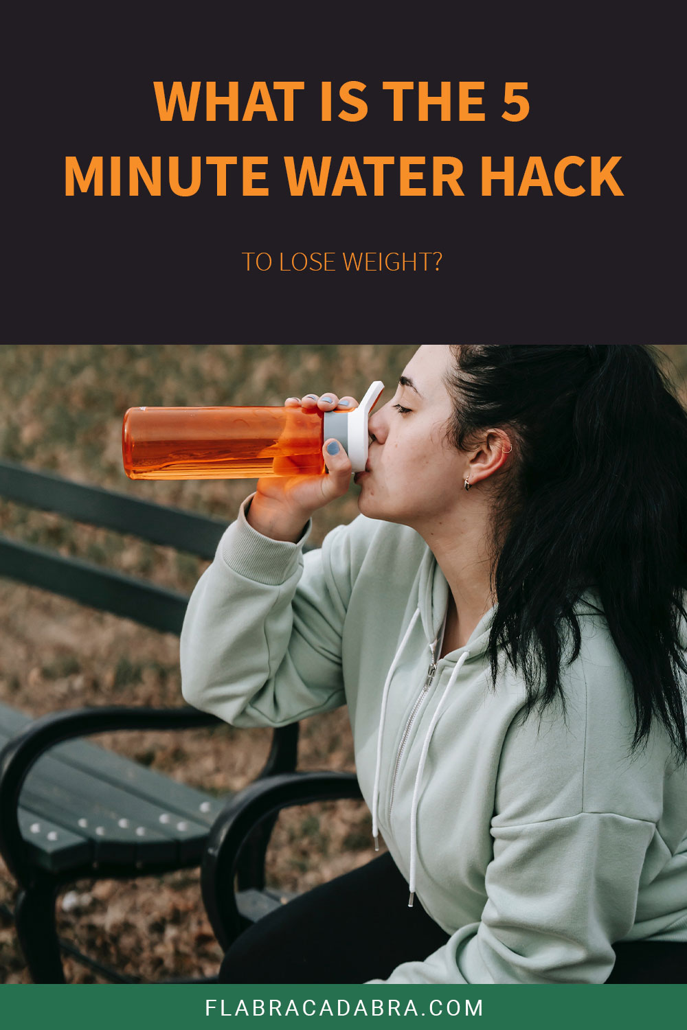 Woman sitting on a park bench drinking from a water bottle - What is the 5 Minute Water Hack to Lose Weight?