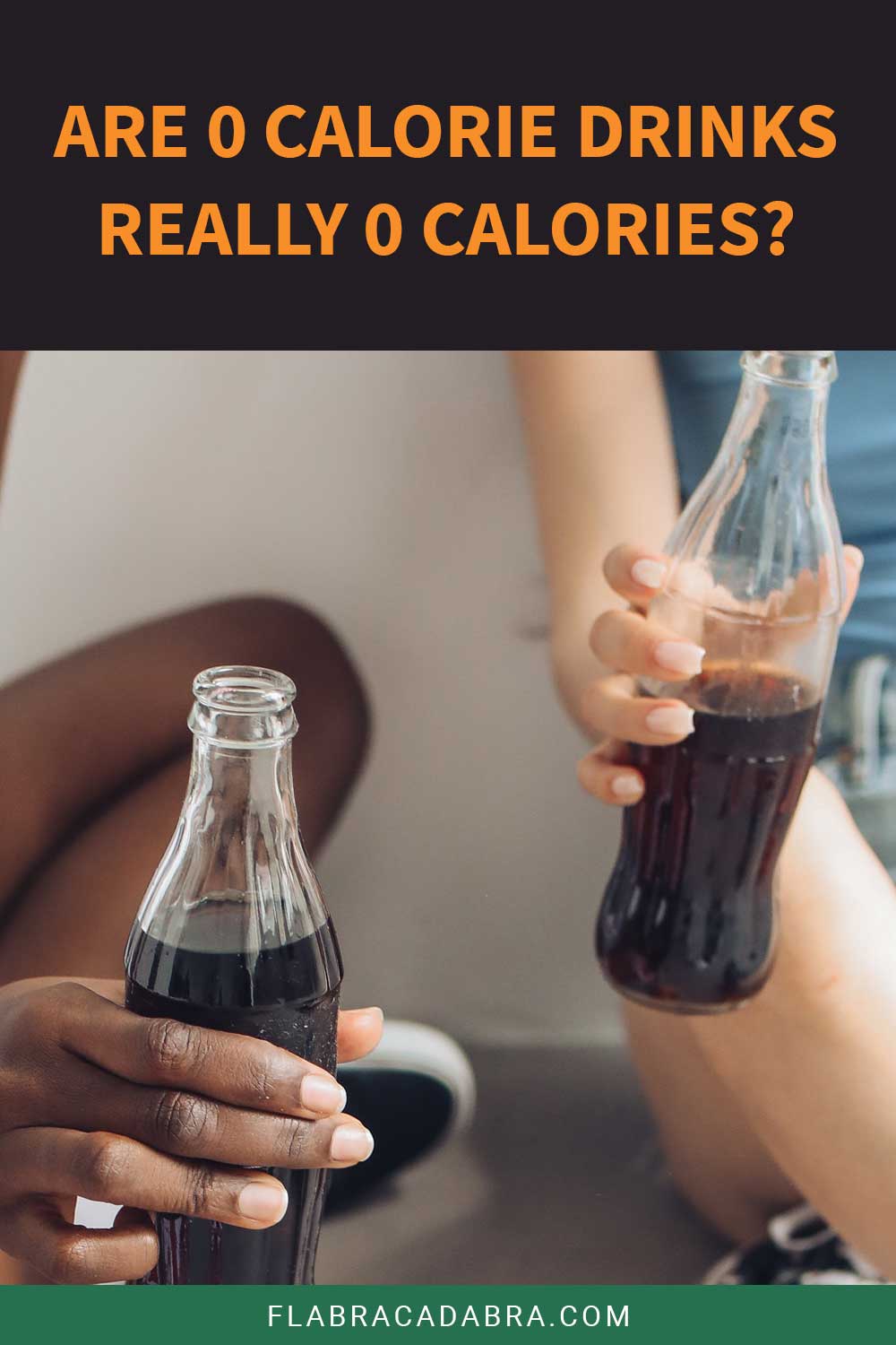 Two Coca cola glass bottles in hands - Are 0 Calorie Drinks Really 0 Calories?