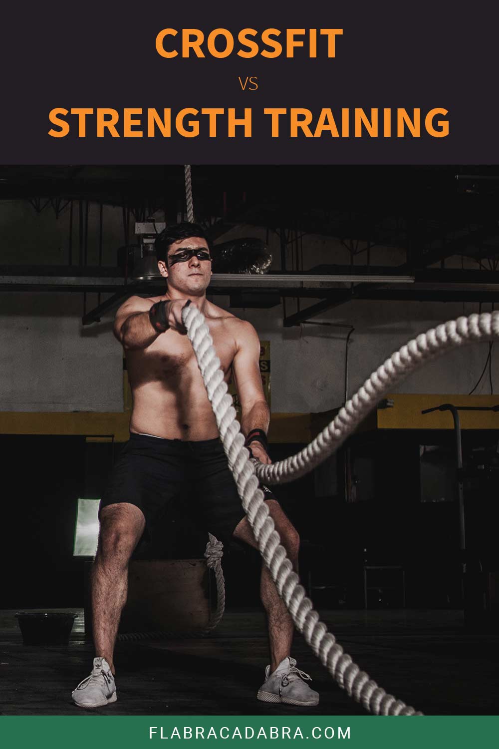 Man doing battle rope workout - CrossFit vs. Strength Training.